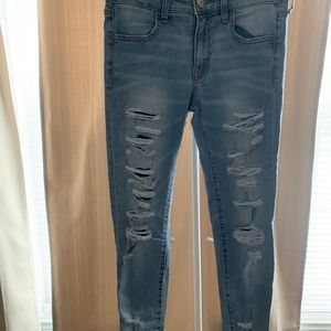 Light blue skinny distressed jeans